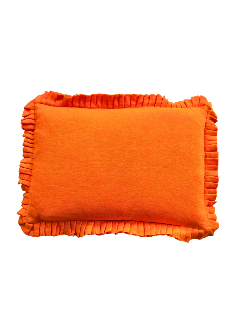 Orange pillow with ruffled edges on a white background