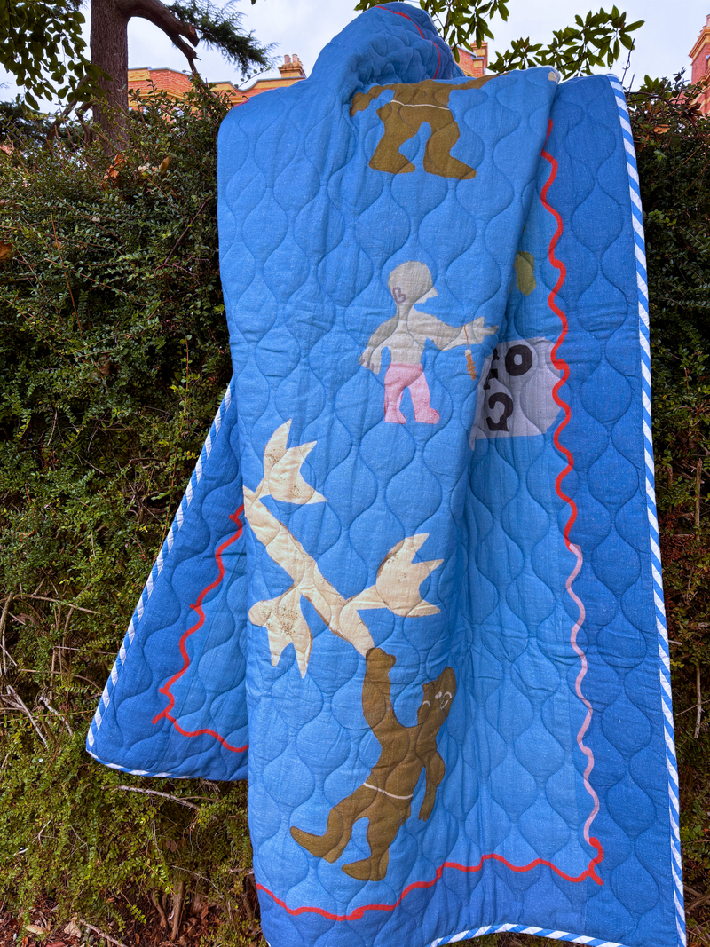 Asafo Blue quilt, printed design of a tree and various characters in natural background.